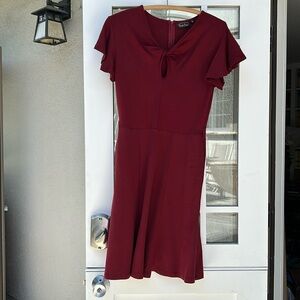 VoodooVixen peephole neckline stretch fabric dress.